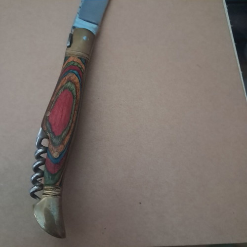 Vintage folding knife like new with multicolored wood handle