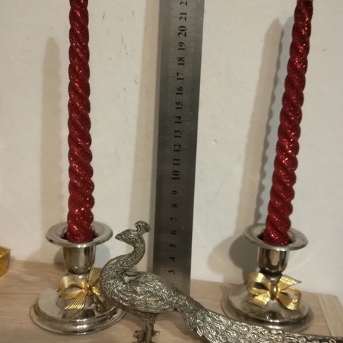 Silver-plated candlesticks with candles and peacock figurine like new