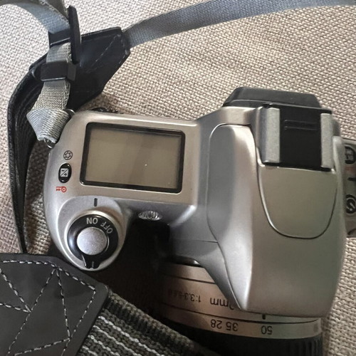 Nikon F65 SLR 35mm camera with AF Nikkor 28-80mm lens and Delsey case