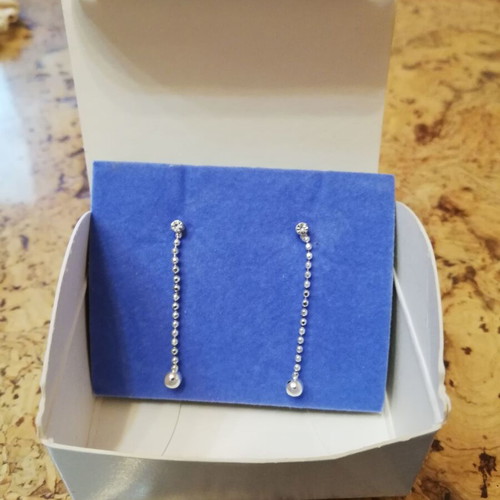 Avon silver hanging earrings with crystals, new in original box