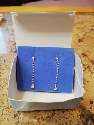 Avon silver hanging earrings with crystals, new in original box