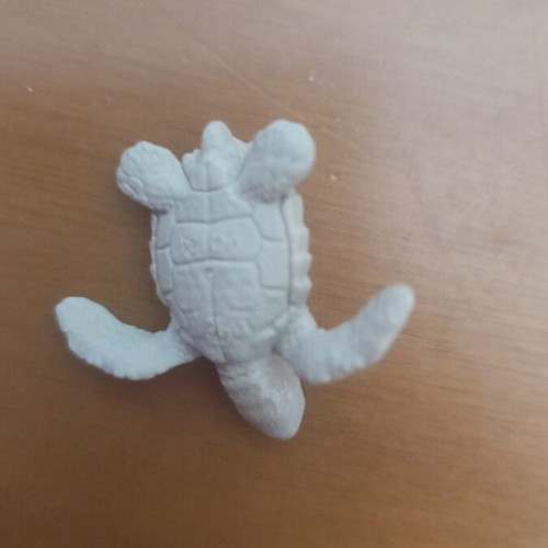 Small plastic turtle like new, light green color