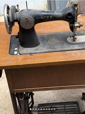 Singer sewing machine used with cabinet