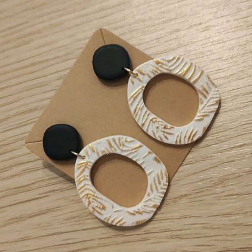 Earrings new, polymer clay with black, white, and gold colors