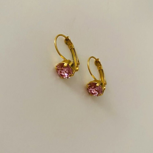 Earrings used, gold color with pink stone