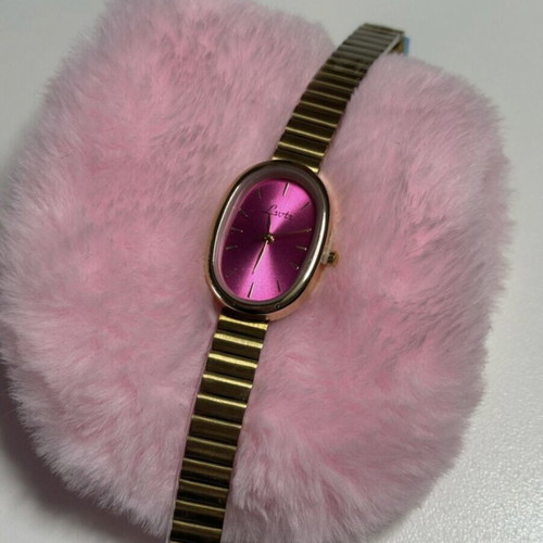 Gold watch with fuchsia dial like new, women's
