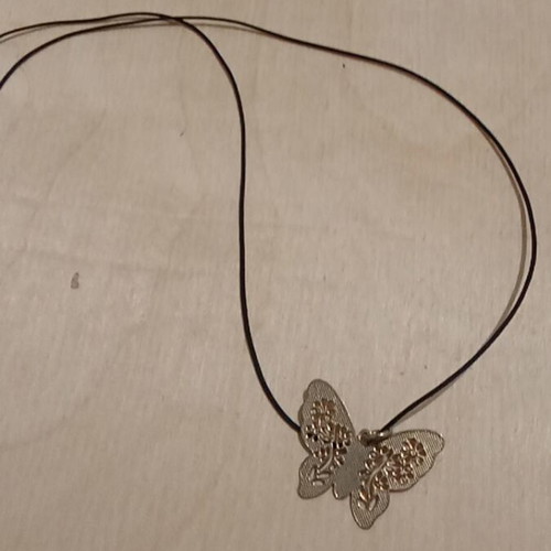 Butterfly pendant used, metallic gold with synthetic silk cord