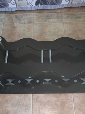 Black coffee table with glass and wheels