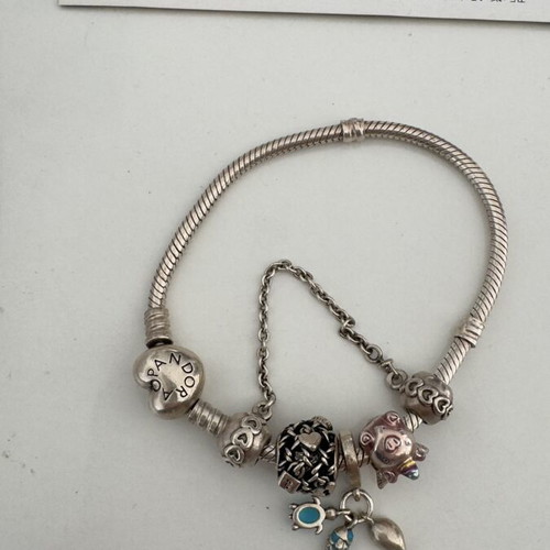 Pandora bracelet and charms like new with certificates