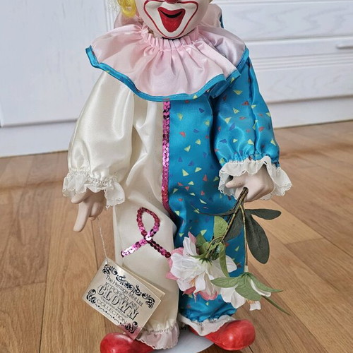 Heritage Mint porcelain doll like new with stand