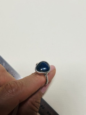 Silver ring with dark blue agate stone