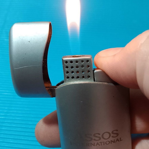 Assos International lighter used, refillable and fully functional