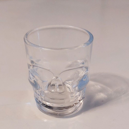 Collectible glass shot glass with 3D skull design like new