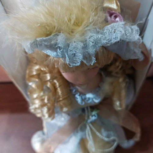 Porcelain doll with stand new, vintage style
