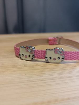 Hello Kitty pink faux leather bracelet with metal charms