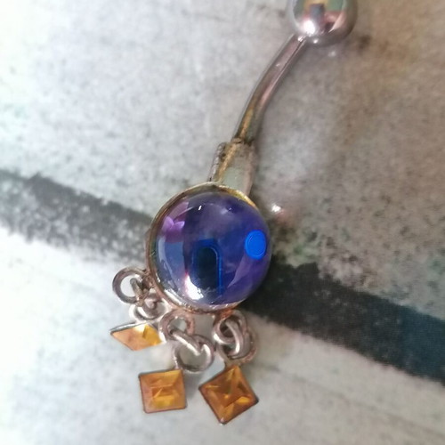 Aurora borealis navel piercing with color-changing crystal