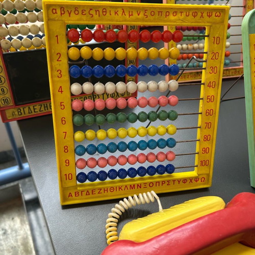 Vintage toys used, 1970s abacus counters, plastic phone