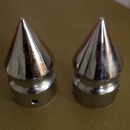 Spike-shaped caps for front wheel axle
