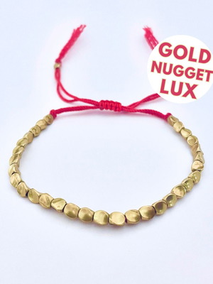 Bronze bracelet new with red cord