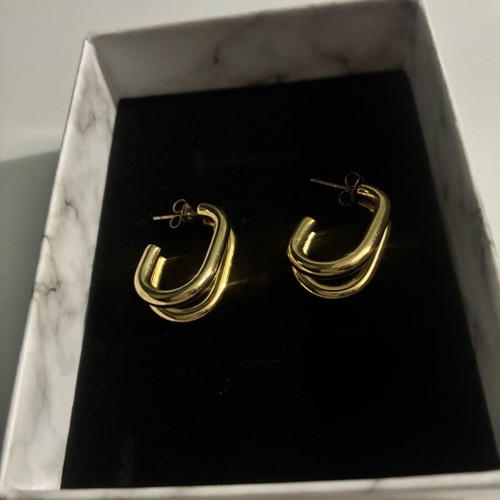 Steel hoop earrings in gold color new in box