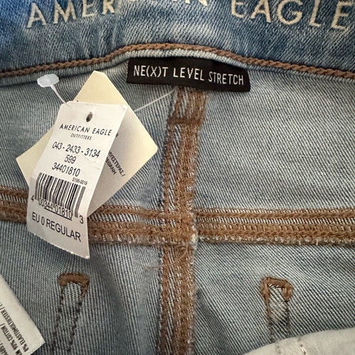 American Eagle stretch jean with rips new size S