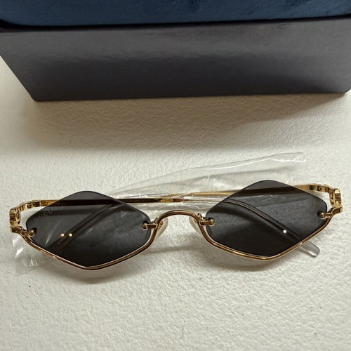 Gucci GG1604S 001 sunglasses, gold frame with black lenses