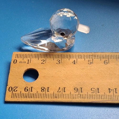 Glass figurines dolphin and duck used, mirror base