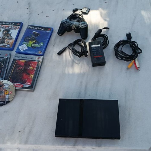 Sony PlayStation 2 slim console with 5 games, power supply and cables
