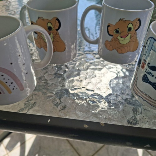 Ceramic mugs like new, pack of 4 with various designs