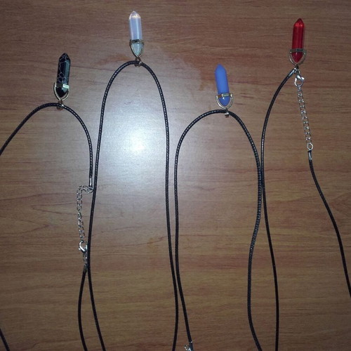 Set of four necklaces with stones, new