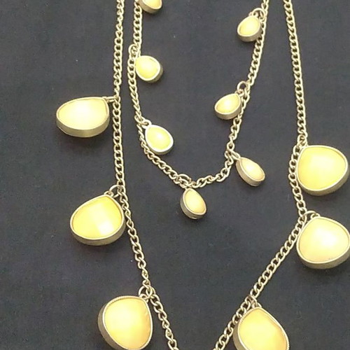 Double long necklace with matte gold chain and beige decorations
