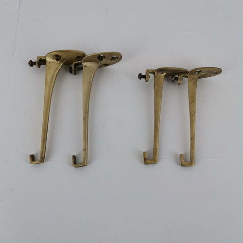 Pair of brass curtain hooks with clamp used
