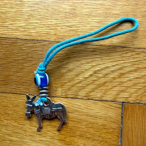 Donkey keychain like new with silver motif and blue eye bead