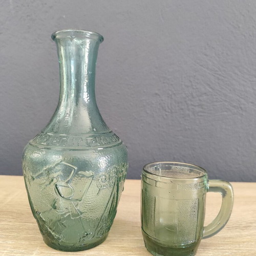 Vintage glass carafe with wine glass used