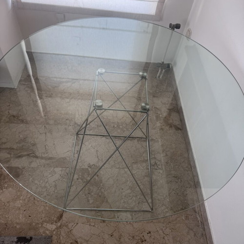 Round glass dining table used with silver detailing 100x76