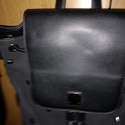 Crossbody bag new, black color, convertible to backpack