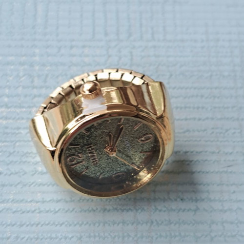 Ring watch quartz with khaki dial and gold bracelet like new