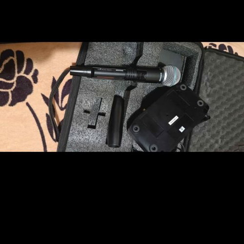 Shure Beta 58a GLXD4 wireless microphone used with case