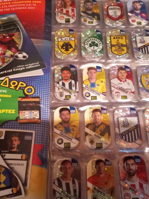 Super League collectible album with 44 metal tags used