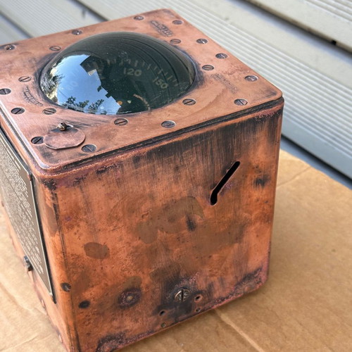 Old copper submarine compass used with artificial horizon