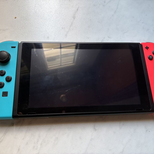 Nintendo Switch V2 console used with 2 games and carrying case