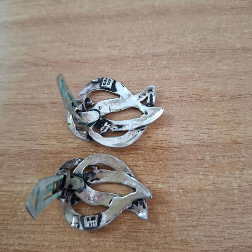 Vintage metal earrings used with abstract artistic design silver