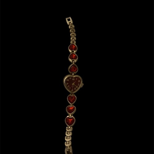 Heart-shaped wristwatch with red stones