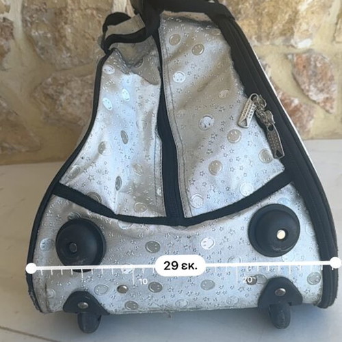 Smiley metallic travel bag used with embossed smiley and star designs