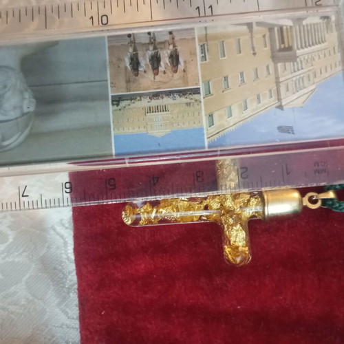 Cross with pure gold leafs in solution, metal