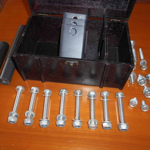 Box with various metal parts and 18 screws used