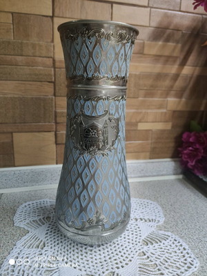 Vintage decorative vase used with silver-plated body and blue enamel
