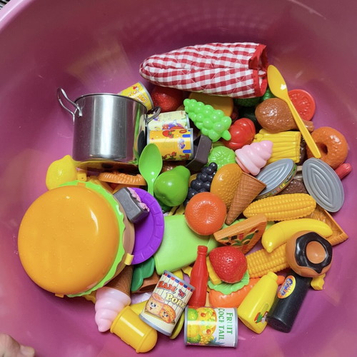 Children's toys used with plastic kitchen items, fruits, vegetables