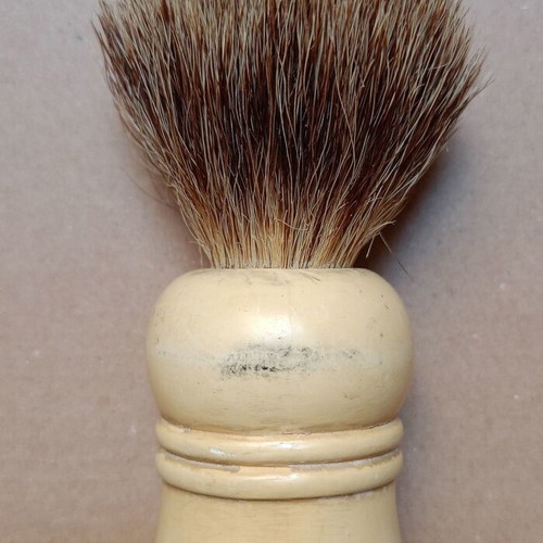 Two shaving brushes, one says it is made in West Germany.
