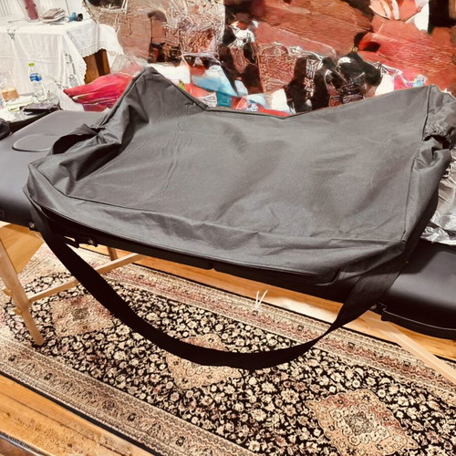Portable folding massage bed with vinyl mattress, wooden frame